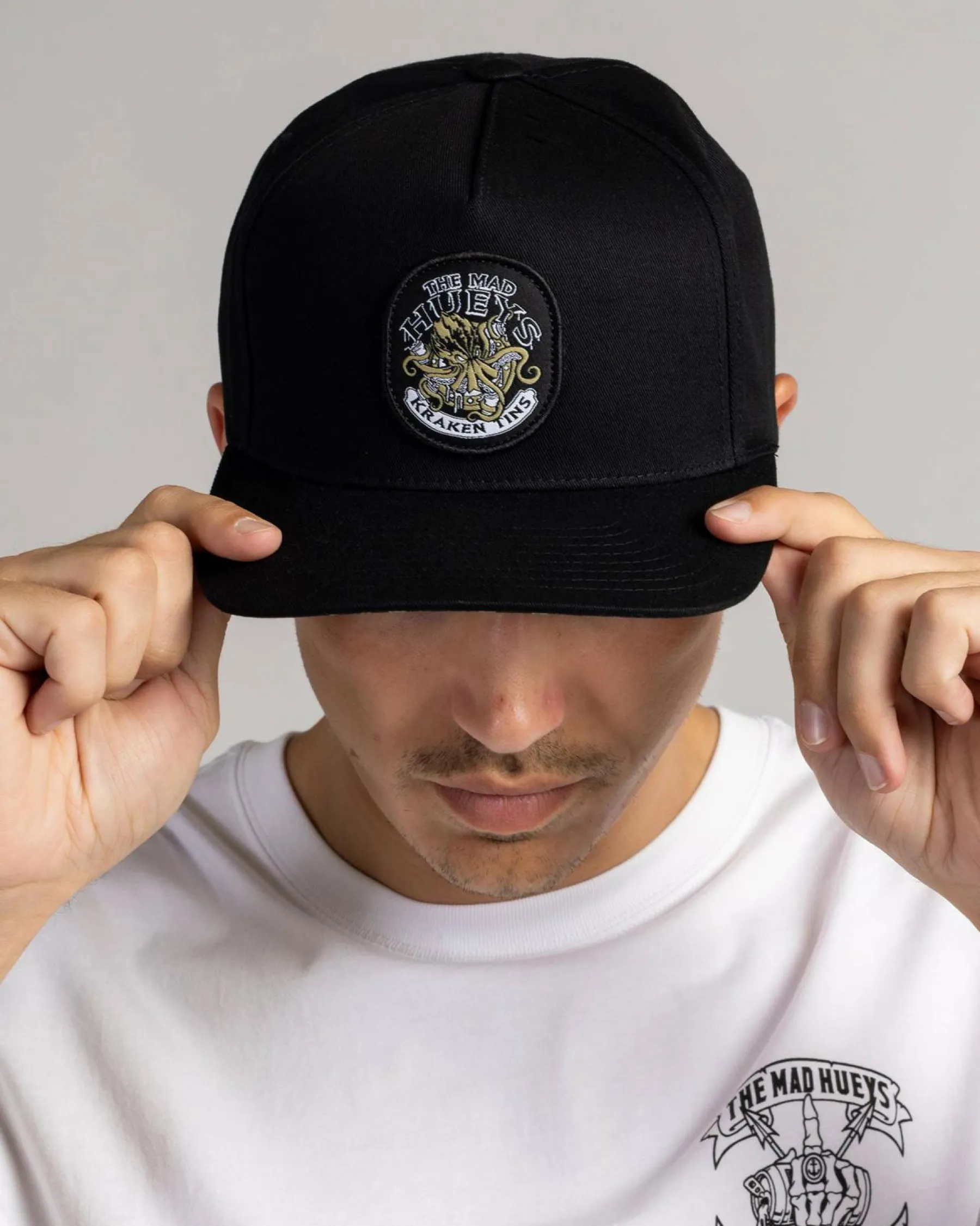 Headwear*The Mad Hueys Kraken Port Hole Snapback Cap Black