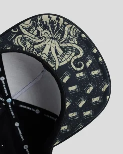 Headwear*The Mad Hueys Kraken Port Hole Snapback Cap Black